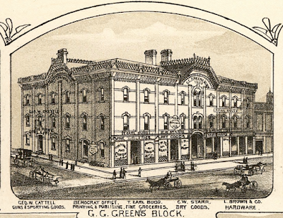 Engraving of G. G. Green's Block, 108 S. Broad Street, Woodbury, with horse-drawn carriages on the corner